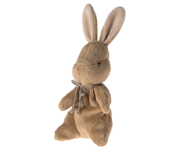 Brown plush bunny with a bow tie on a white background