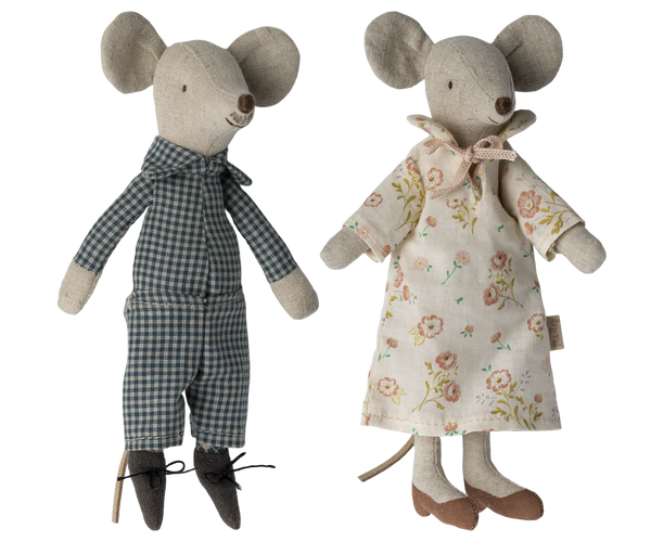 Two toy mice, one in a checkered outfit and the other in a floral dress, on a white background.