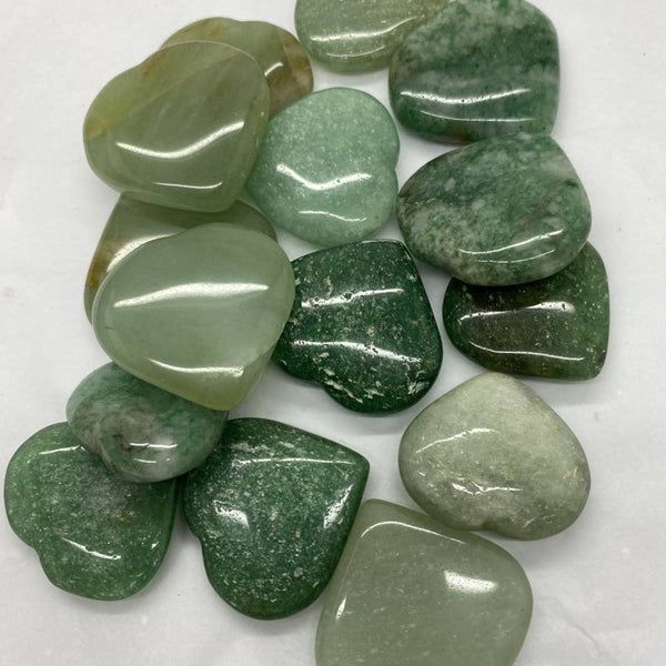 Collection of green aventurine stones on a white background