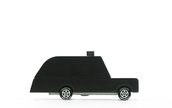 Black toy car model on a white background
