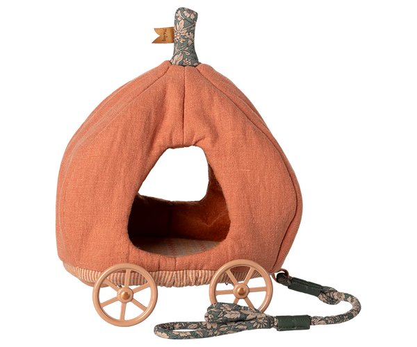 Pumpkin-shaped fabric carriage with wheels and a handle on a white background