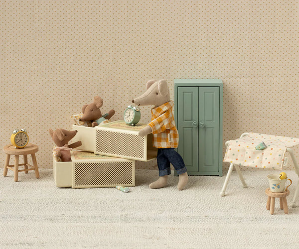 Miniature scene with toy animals in a room setting