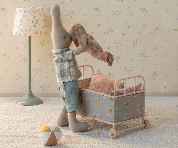 Stuffed toy bunnies in a toy nursery setting