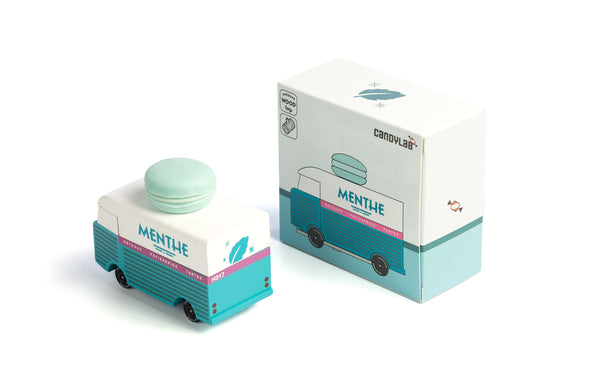 Mint green macaron with a matching box on a white background