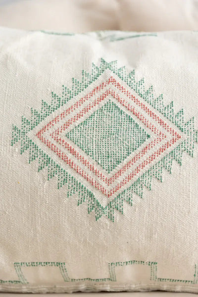 Decorative pillow with geometric pattern on a neutral background