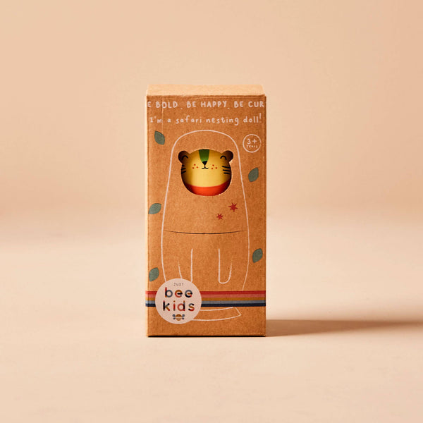 Box packaging of a safari nesting doll by bee kids on a beige background