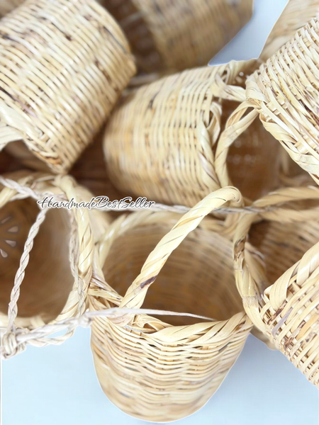 Mini wicker basket decorations stacked together on a light blue background