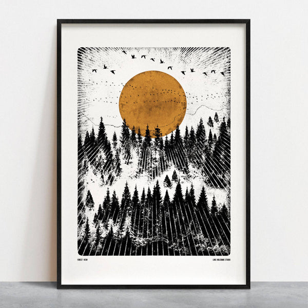 Framed artwork of a forest with a large orange circle on a white wall.