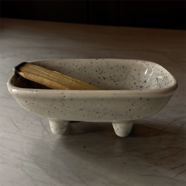 Ceramic dish for burning smudge sticks and incense on a white background