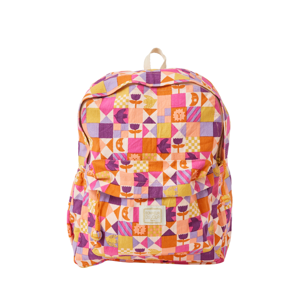 Colourful geometric patterned backpack on a white background
