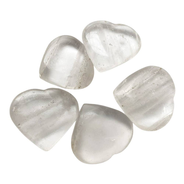 Five clear quartz heart-shaped crystals on a white background