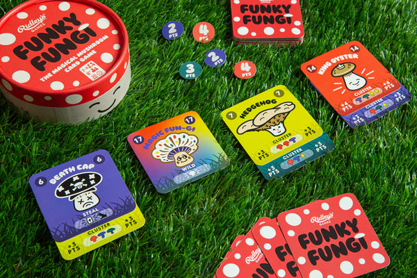 Funky Fungi card game components on grass