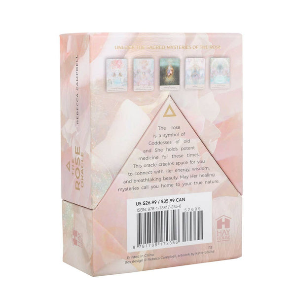 Card deck packaging with oracle cards on a soft pink background