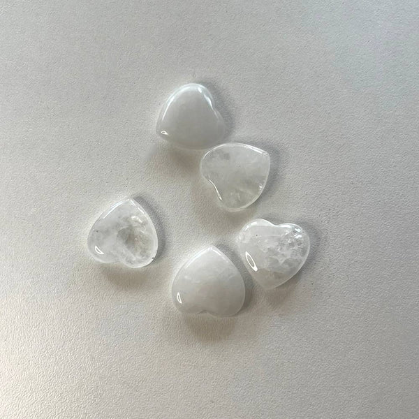 Clear Quartz heart-shaped crystals on a white background