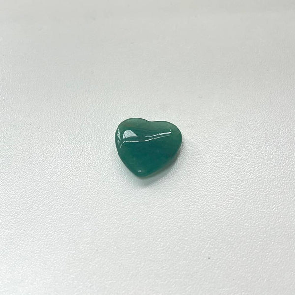 Green Aventurine heart-shaped crystal on a white background