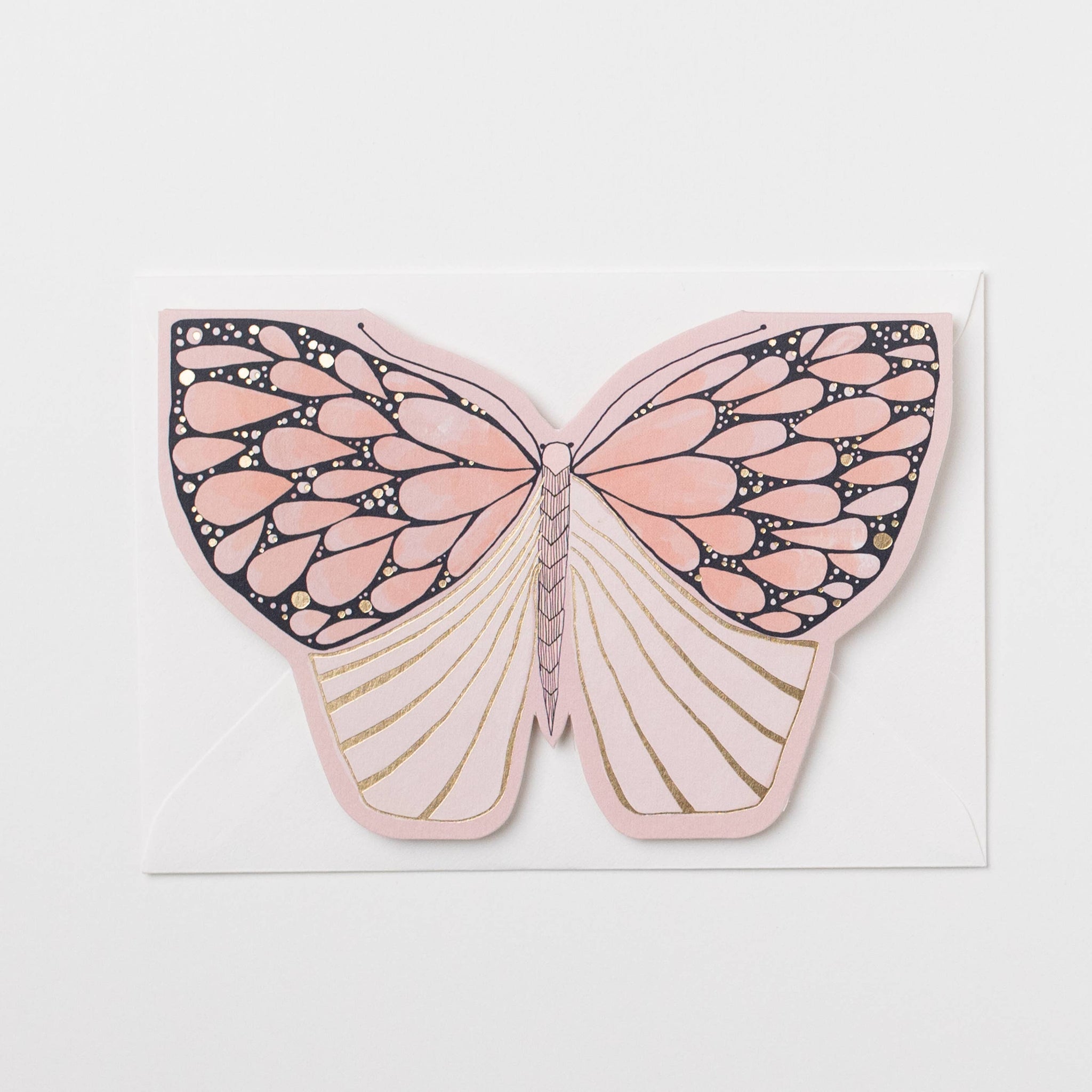 Butterfly-shaped card with pink and gold design on a white background