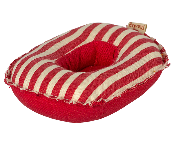 Red and white striped toy rubber boat with a brand tag on a white background