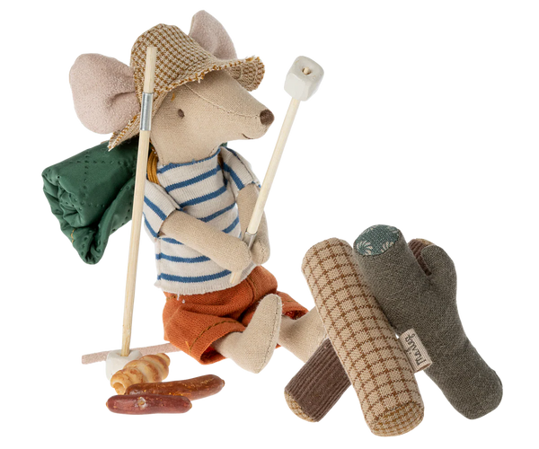 Toy mouse in a cowboy outfit with accessories on a white background