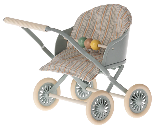Toy stroller with patterned seat and colourful ball on a white background