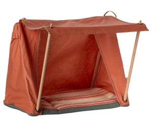 Red pet tent with wooden frame on a white background