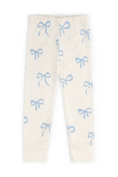 Cream leggings with blue bow patterns on a white background