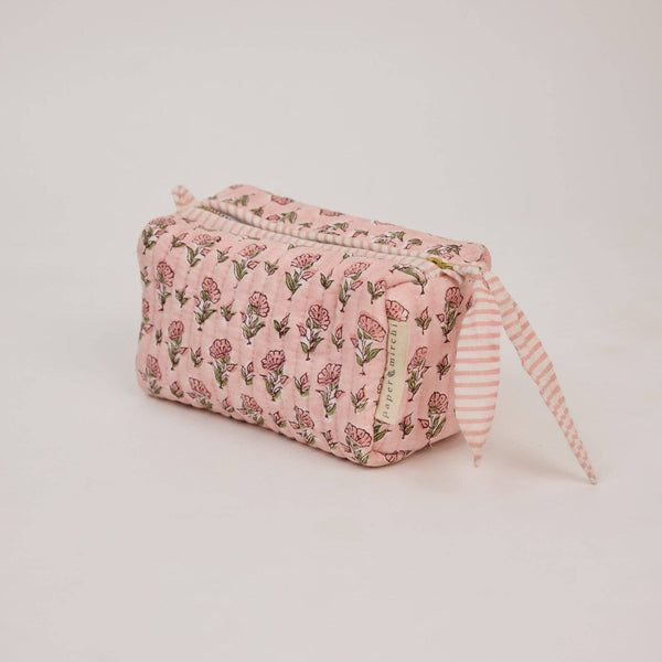 Pink floral patterned pouch with striped pull on a light coloured background