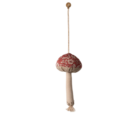 Decorative hanging mushroom with floral pattern and beige tassel on a white background