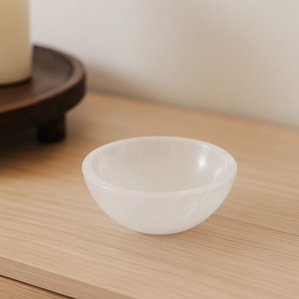 Small white crystal bowl on furniture