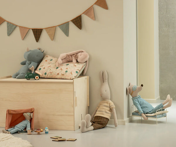 Dozing and sleeping toy animals in a play area