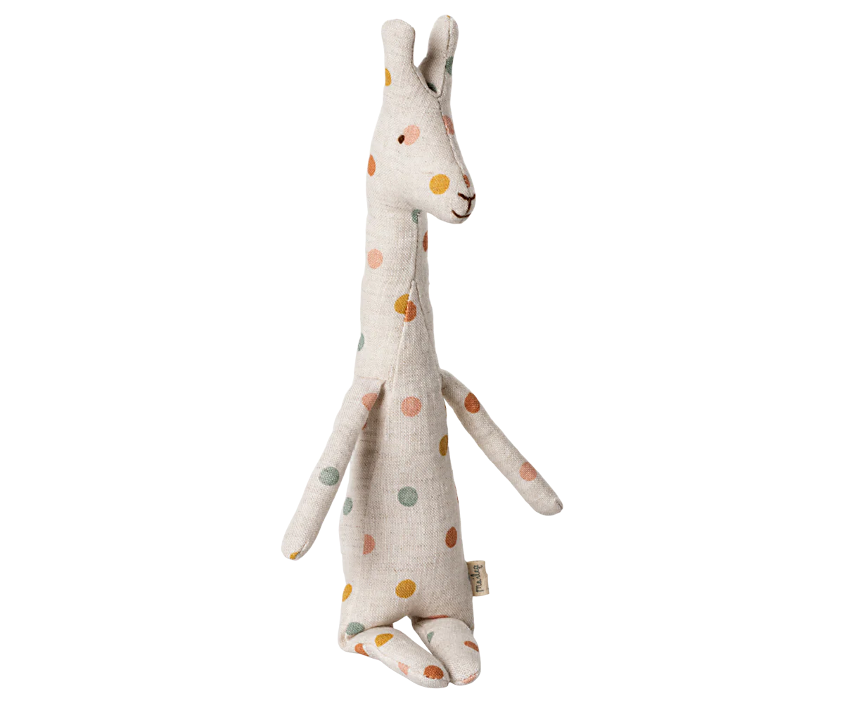 Stuffed giraffe toy with colorful spots on a white background