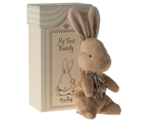 Stuffed bunny toy with 'My First Bunny' packaging on a white background