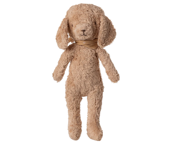 Beige stuffed dog toy on a white background