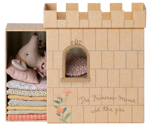 Cardboard castle toy with plush toys and fabric inside, branded 'The Princess Mouse and the Pea'.