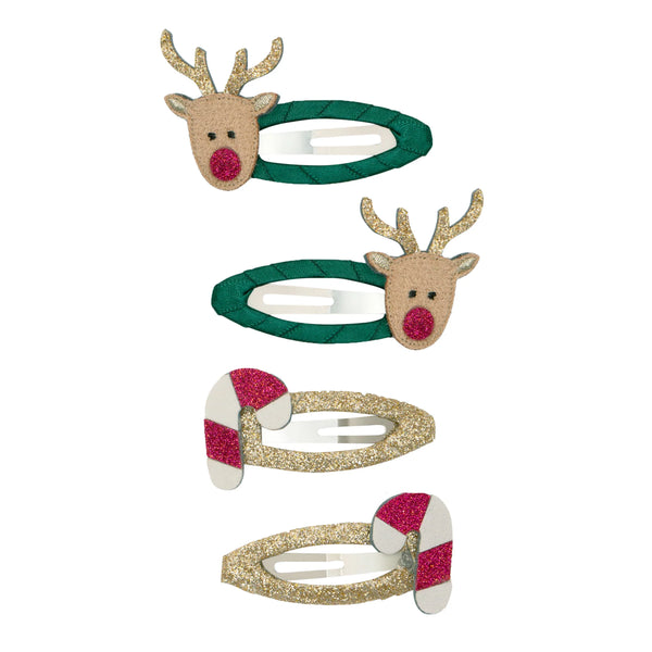 Set of four festive hair clips with reindeer and candy cane designs on a white background