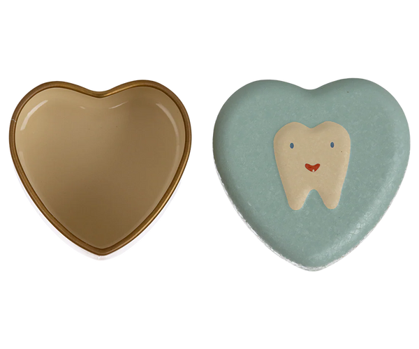 Two heart-shaped objects, one beige and one with a tooth design on a mint green background.