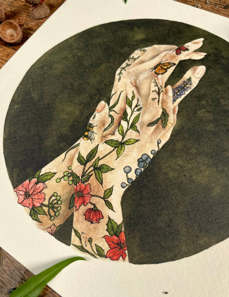 Illustration of hands with floral and butterfly tattoos on a dark background