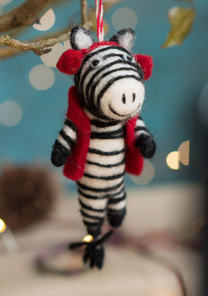 Zebra ornament with red scarf on a blurred background