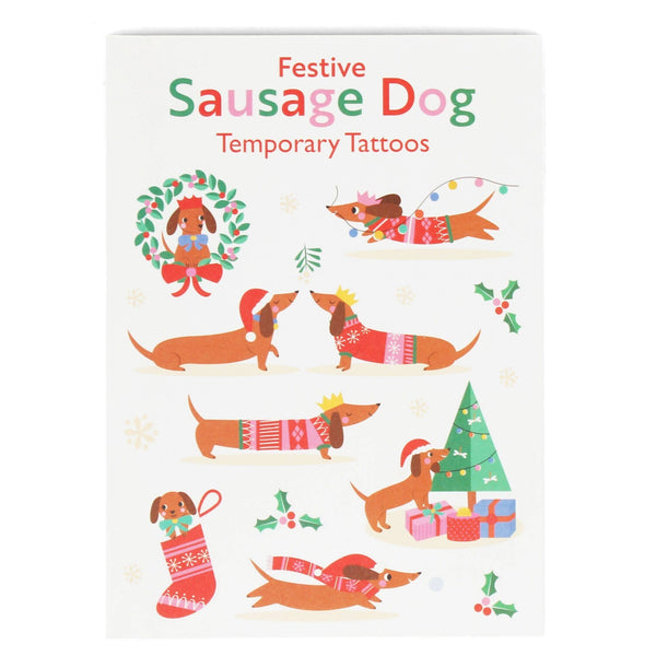 Festive sausage dog temporary tattoos packaging with illustrations of dogs in winter clothing on a white background.