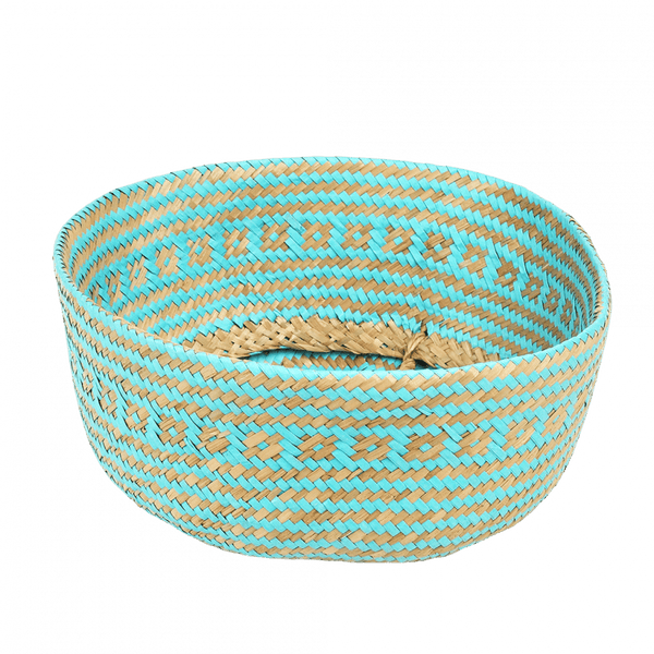 Woven basket with turquoise and beige pattern on a white background