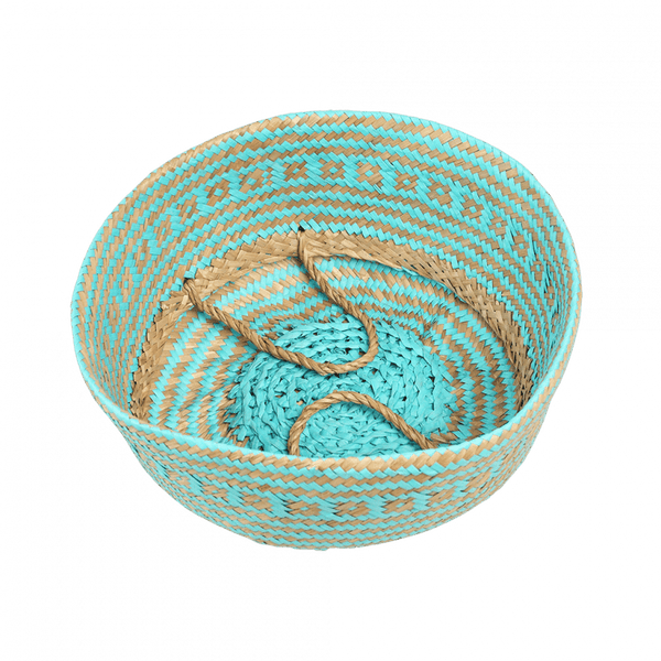 Woven basket with turquoise and brown pattern on a white background
