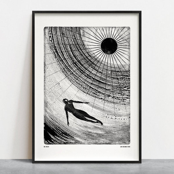 Framed black and white art print of a person diving into water with concentric circles.