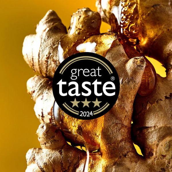 Ginger root with a 'Great Taste 2024' award logo on a yellow background
