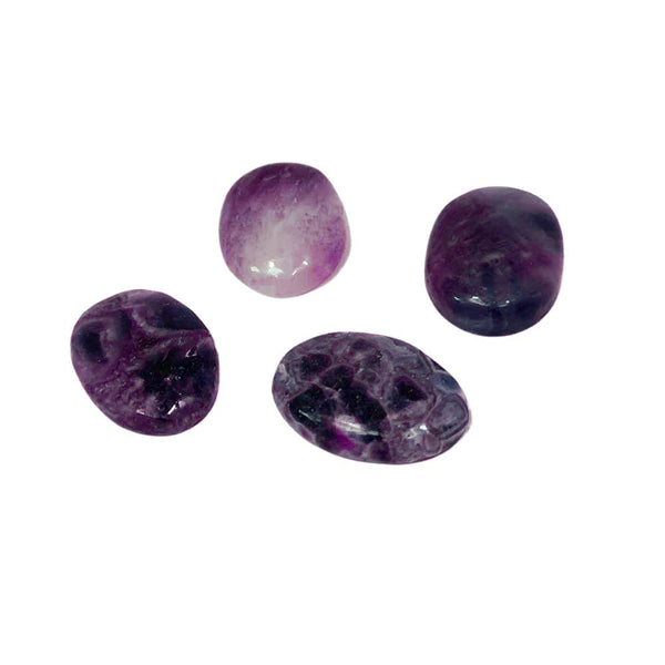 Four purple amethyst stones on a white background