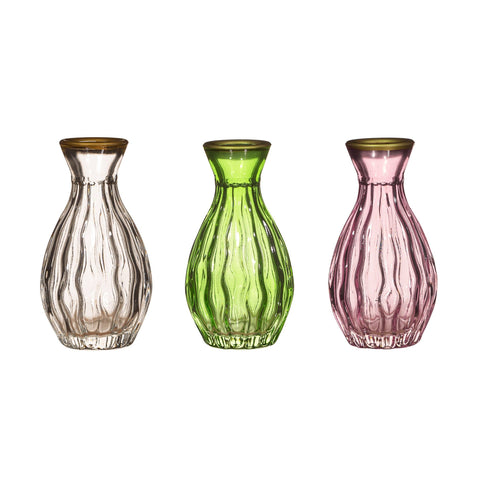 Three glass vases in clear, green, and pink on a white background
