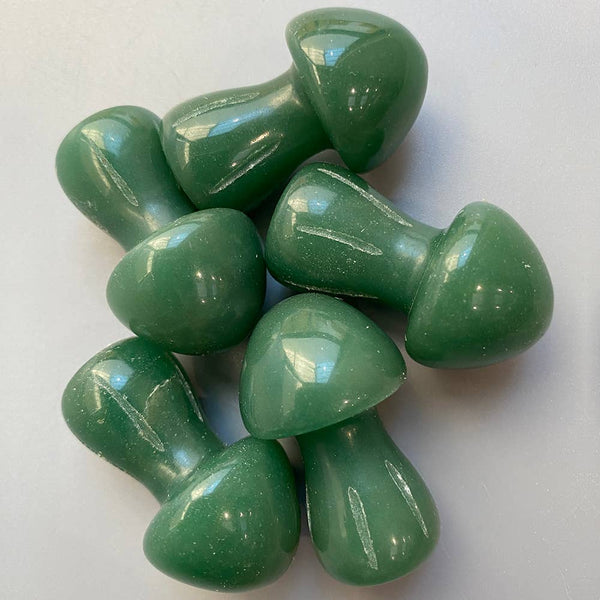 Green aventrine crystal mushrooms on a white background