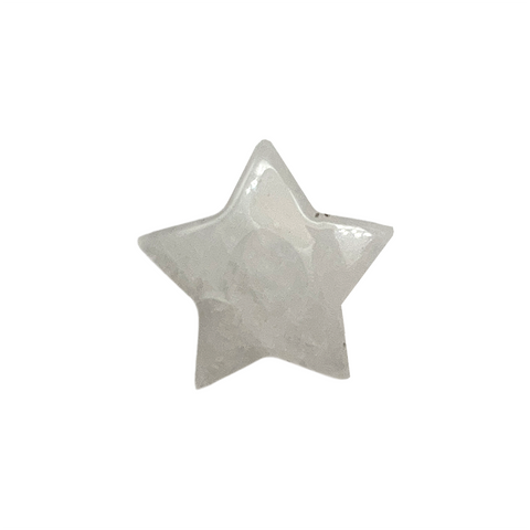 Star-shaped clear quartz gemstone on a white background