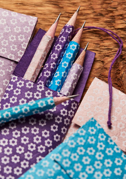 Decorative pencils with floral patterns on a wooden surface