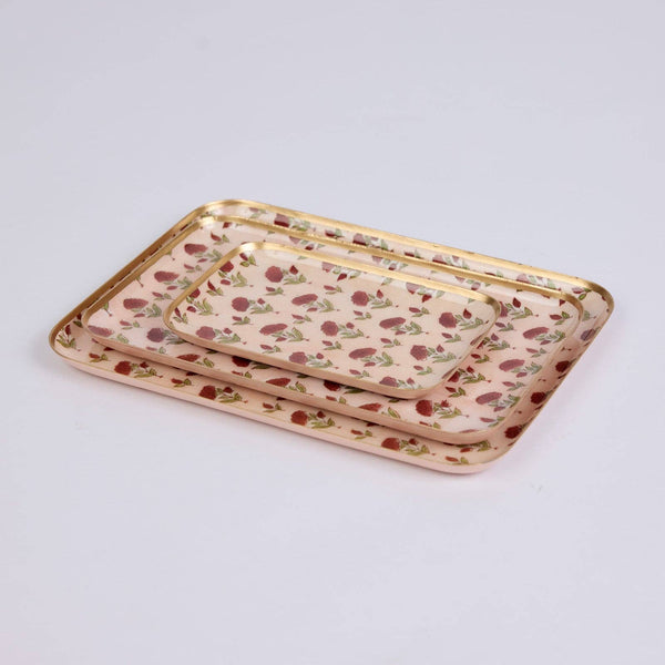 Three nested rectangular trays with a light pink floral pattern and gold trim, displayed on a clean white background.