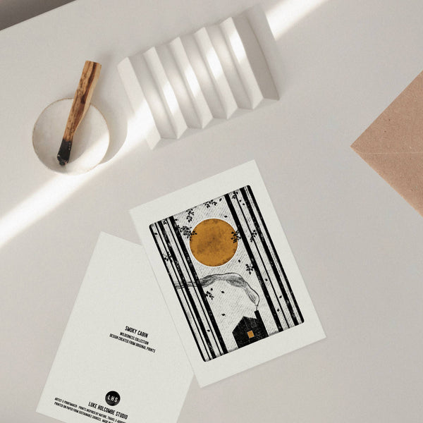 front and back of greeting cards with artistic designs on a light surface.