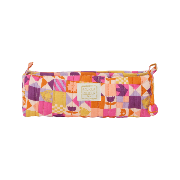 Colorful quilted pencil case with geometric pattern on a white background